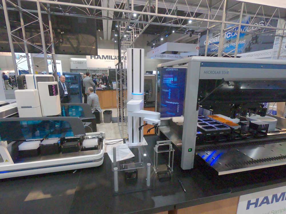 Development and Integration of a Robotic Work-cell to Refill Tips: Old Machine, New Smart Upgrade